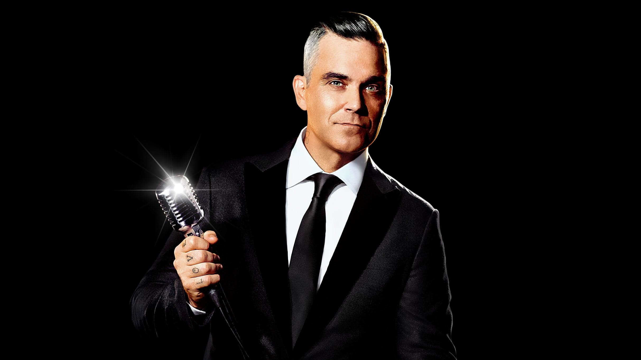 Robbie Williams performing live